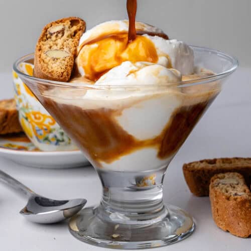 Affogato with coffee being poured into the glass