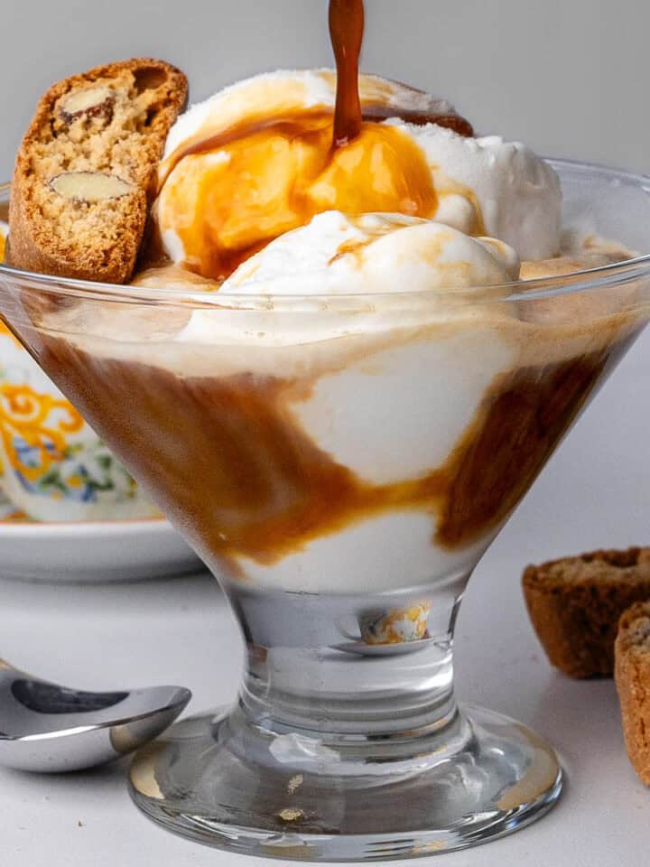 Affogato with coffee being poured into the glass