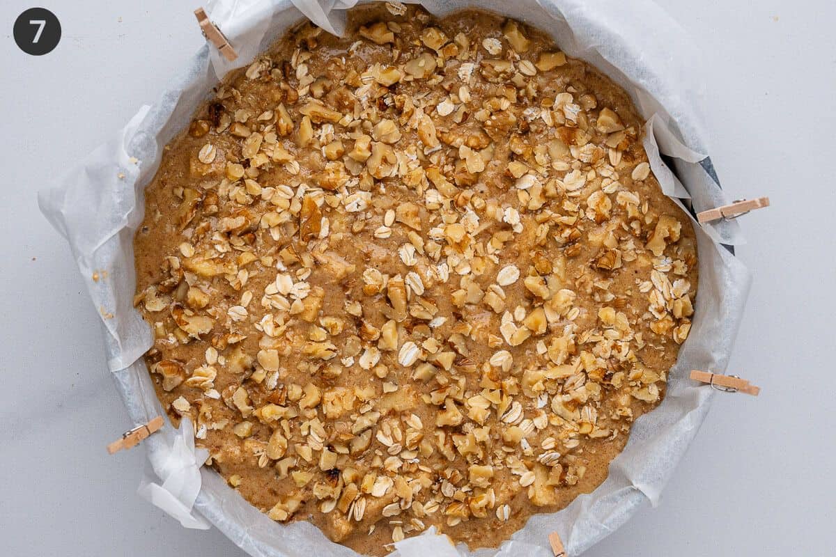 Chopped walnuts and oats added on top of batter