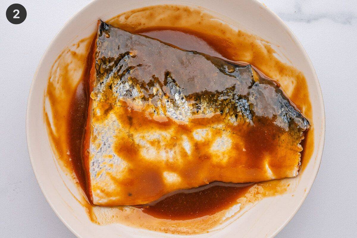 Salmon fillet added to marinade