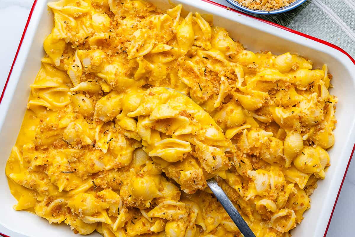Spoon in a tray of butternut squash pasta