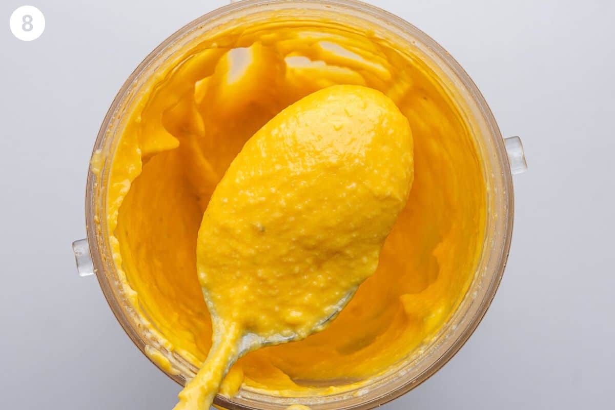 Squash puree blended with close up of a spoon to show the texture