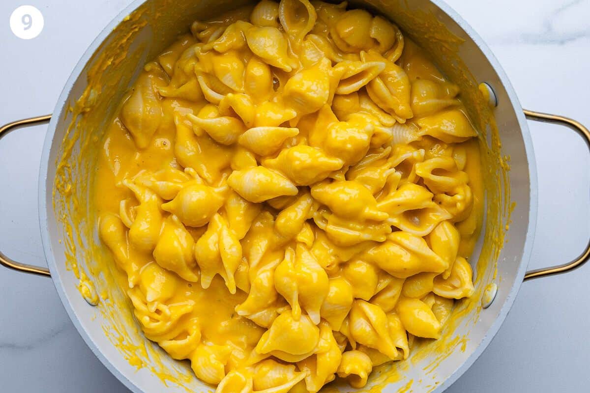 Pasta mixed with squash puree in a large pot