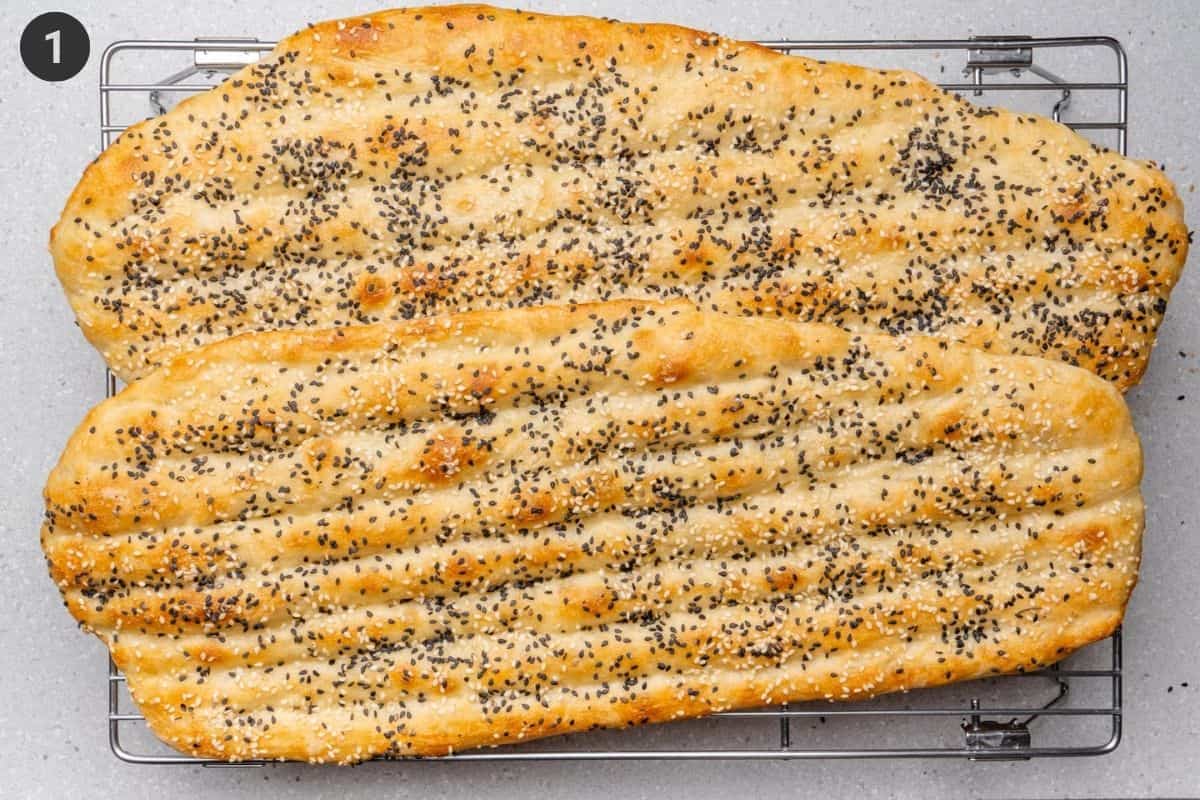 Barbari bread resting on a cooling rack