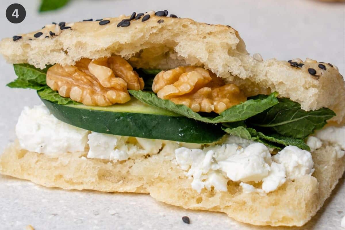 Feta cheese, cucumber, mint and walnuts in between barbari bread