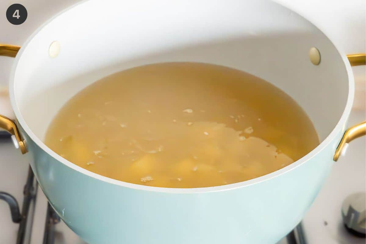 Vegetable broth being prepared in a large pot