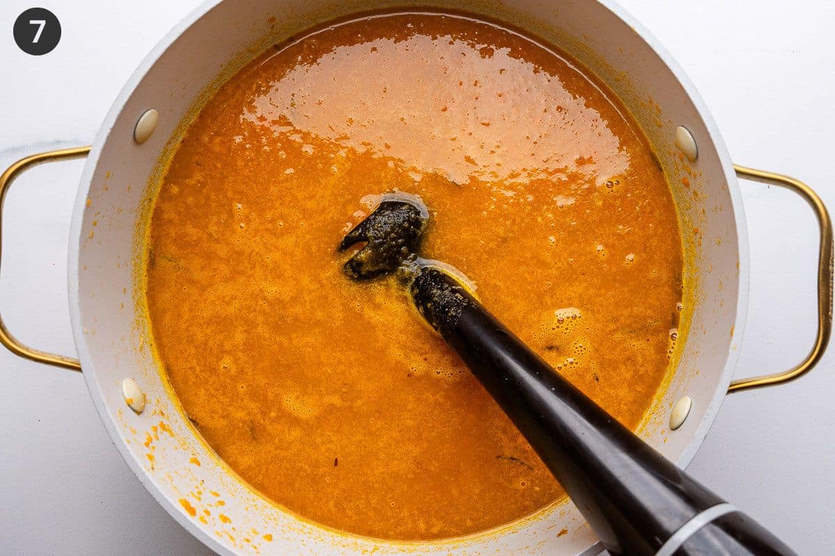 Immersion blender, blending soup until creamy