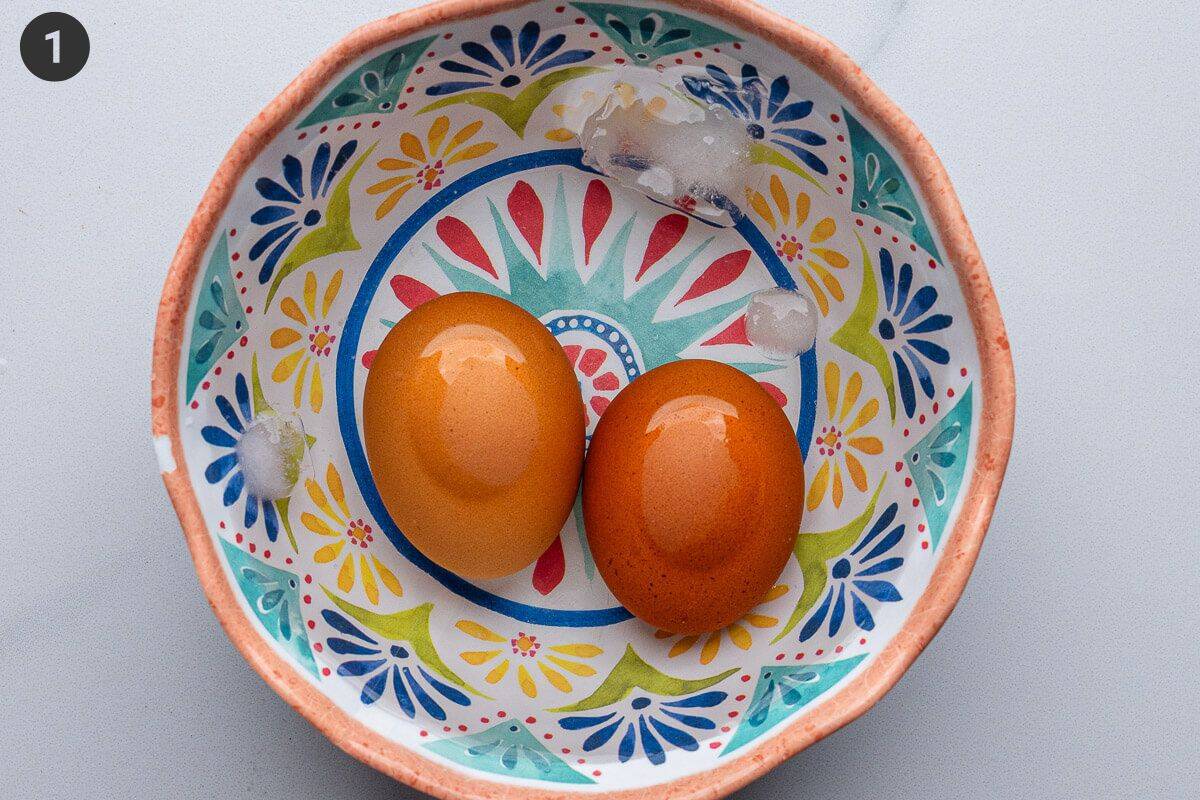 Boiled eggs in a bowl of ice water