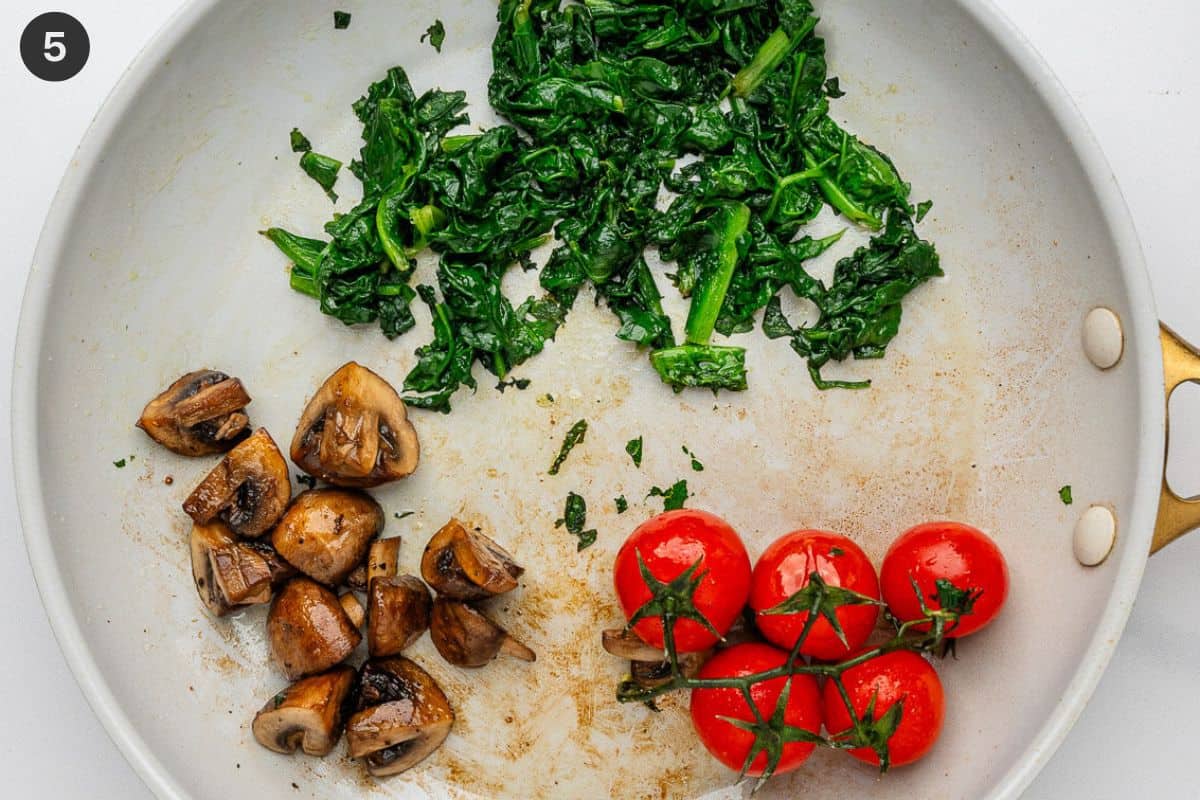 Spinach wilted and veggies ready to serve
