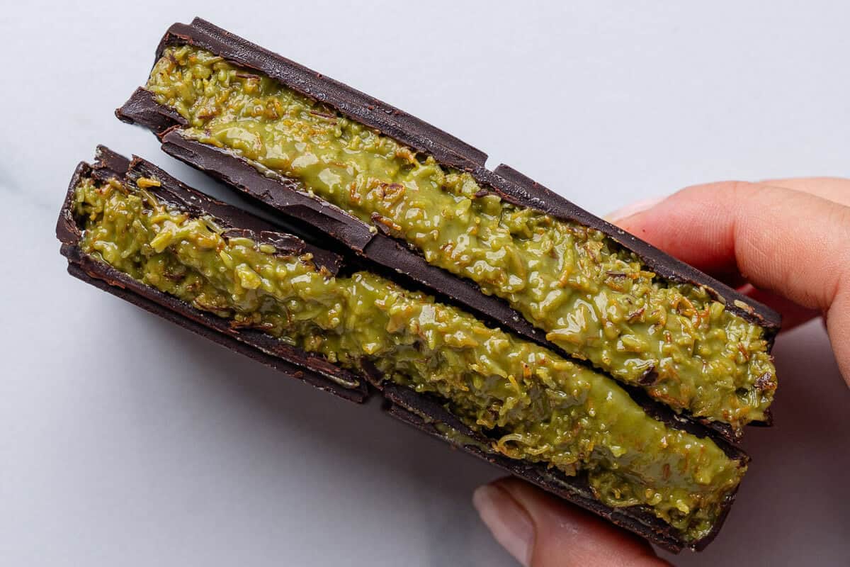 Two pieces of Dubai chocolate snapped in half