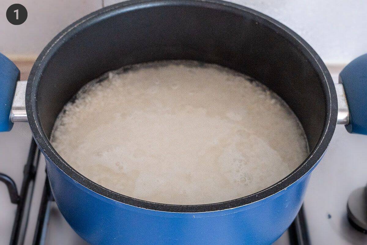 Sushi rice boiling in a pot