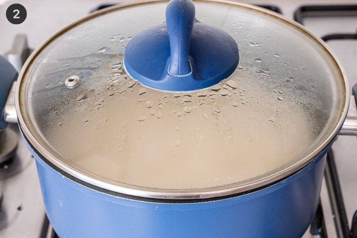 Sushi rice steaming in a pot