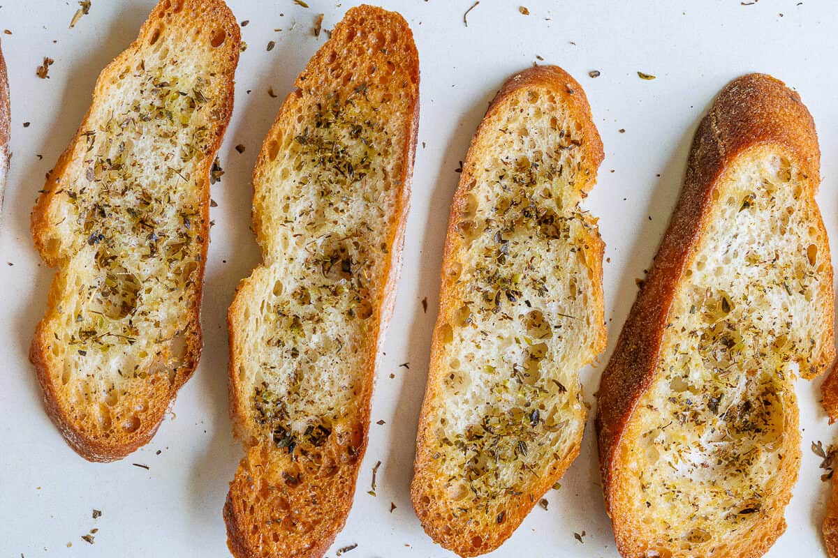 Crostini topped with oregano