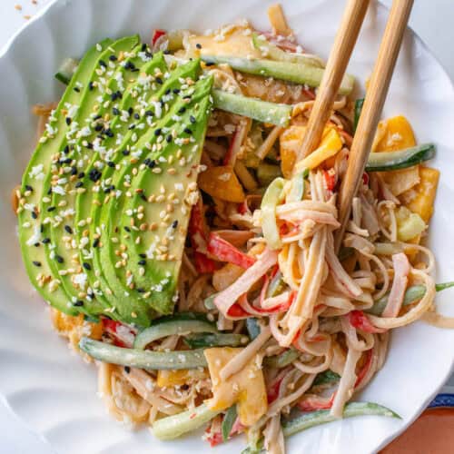Kani salad in a bowl with avocado, sesame seeds and panko