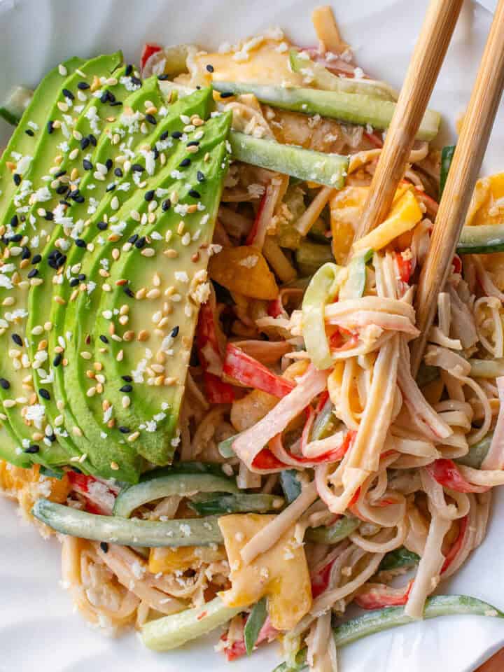 Kani salad in a bowl with avocado, sesame seeds and panko