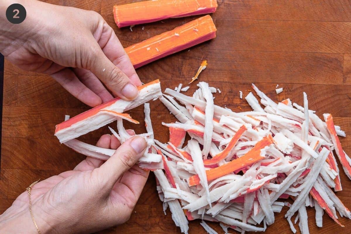 Surimi being pulled apart with hands