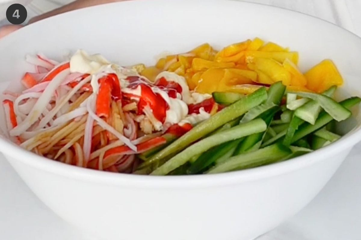 Sauces added to ingredients bowl