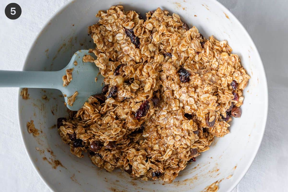 Wet and dry ingredients mixed together with a spatula