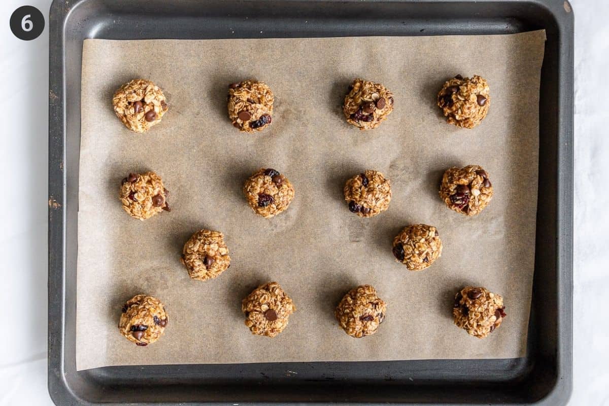 Cookie batter rolled into little balls and placed on an oven tray