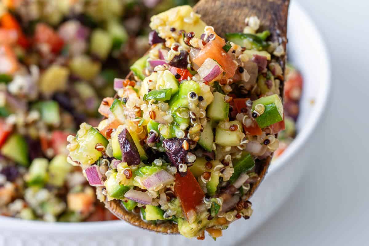 Close up of quinoa salad on a spoon