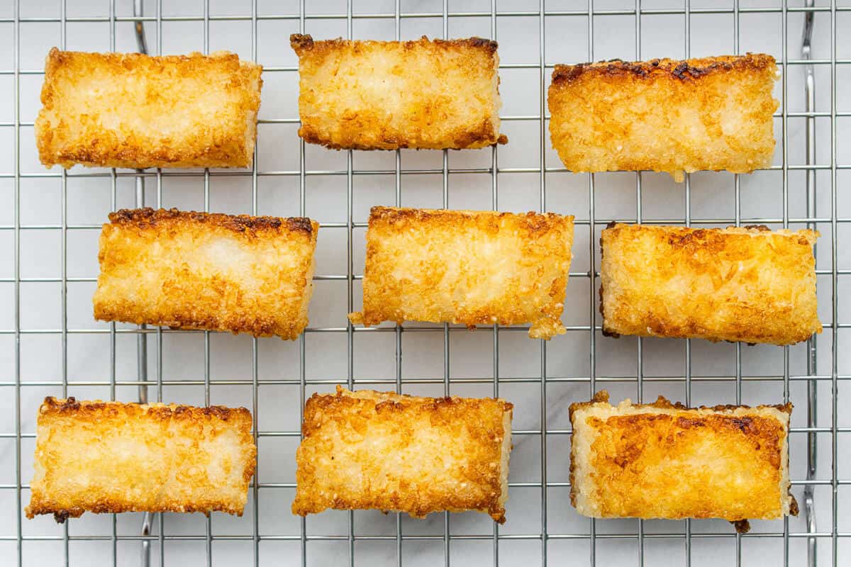 Crispy rice pieces cooling on a wire rack