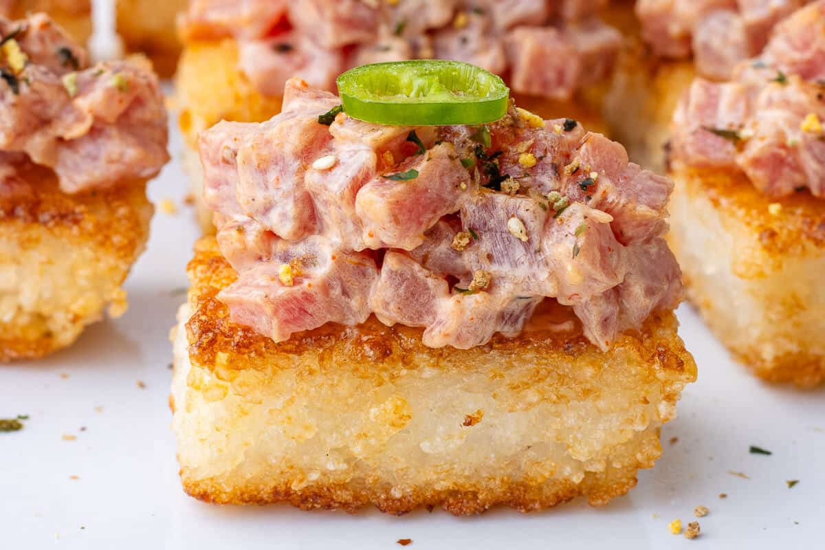 Close up of a piece of spicy tuna crispy rice