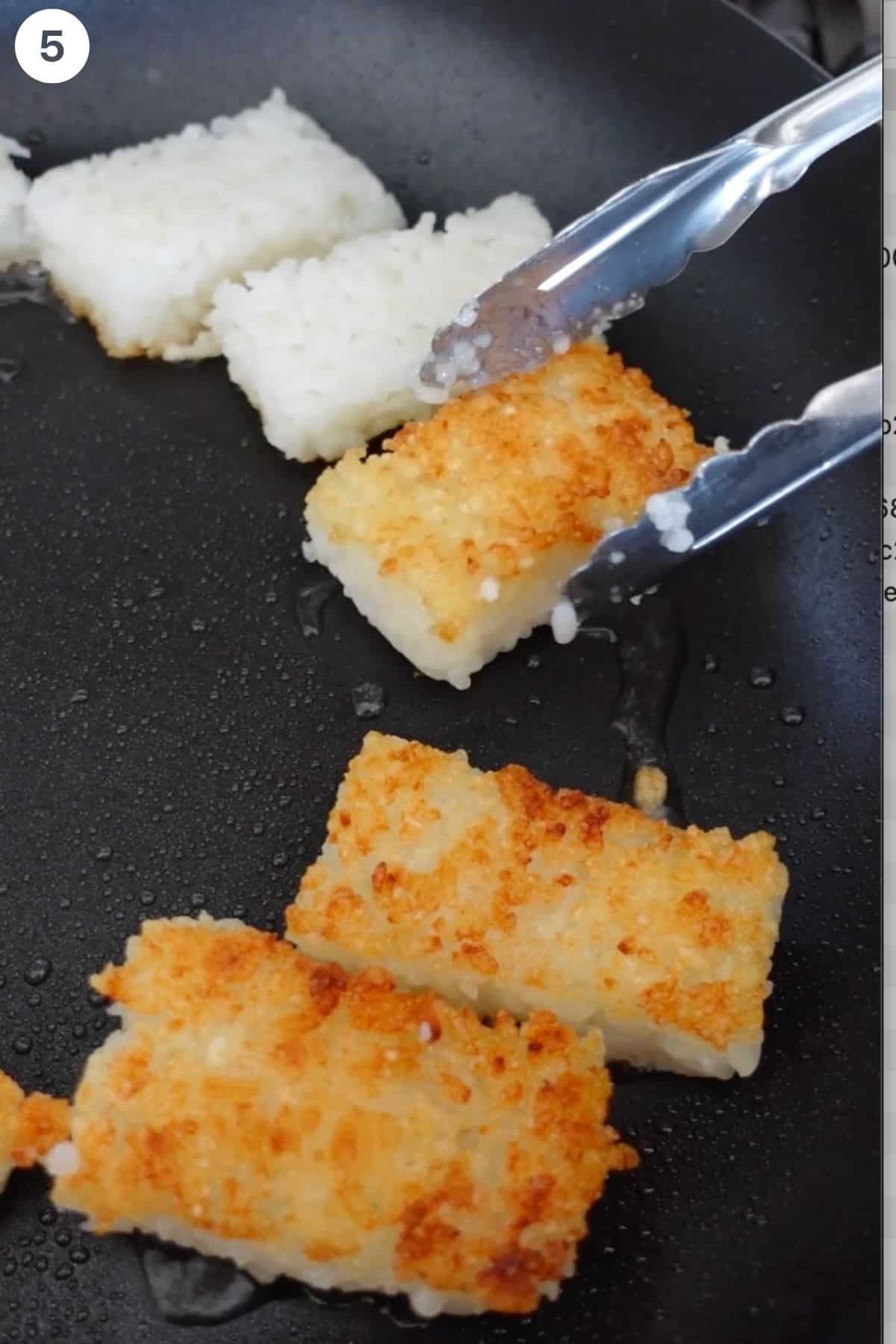 Crispy rice being fried in a pan