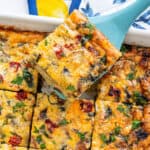 Breakfast Casserole with a piece being lifted with a spatula