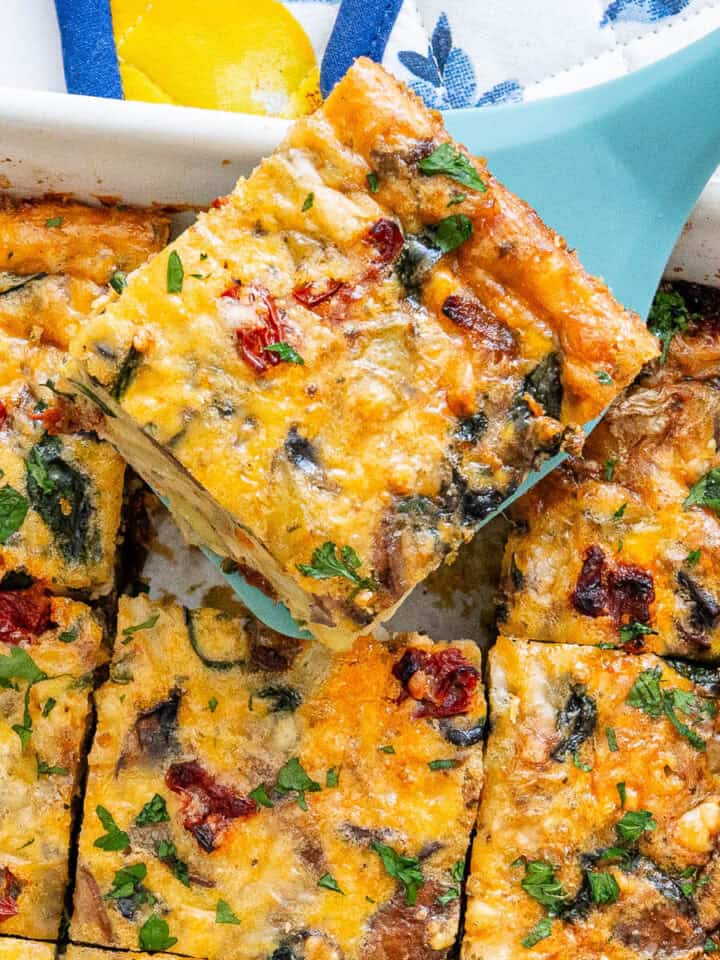 Breakfast Casserole with a piece being lifted with a spatula