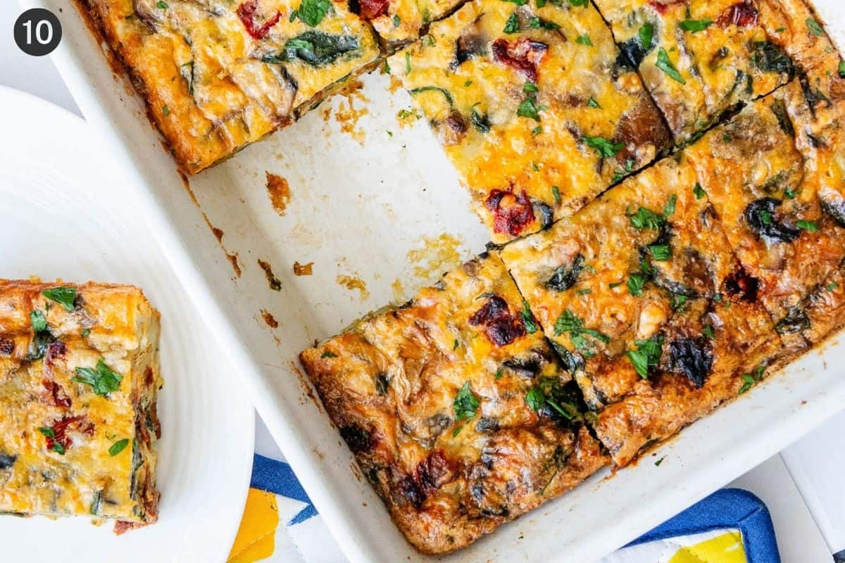 Tray of casserole with piece missing and served on a plate