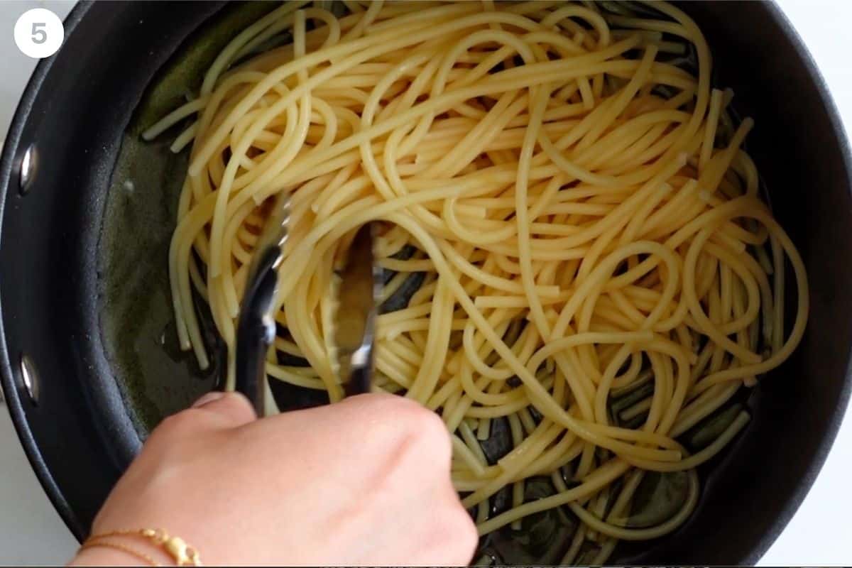 First layer of pasta added to the bottom of the pot