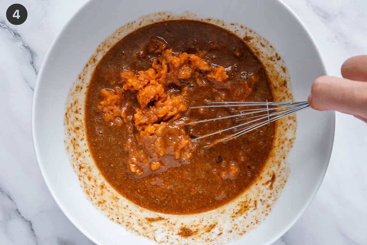 Sweet potato being whisked into the batter