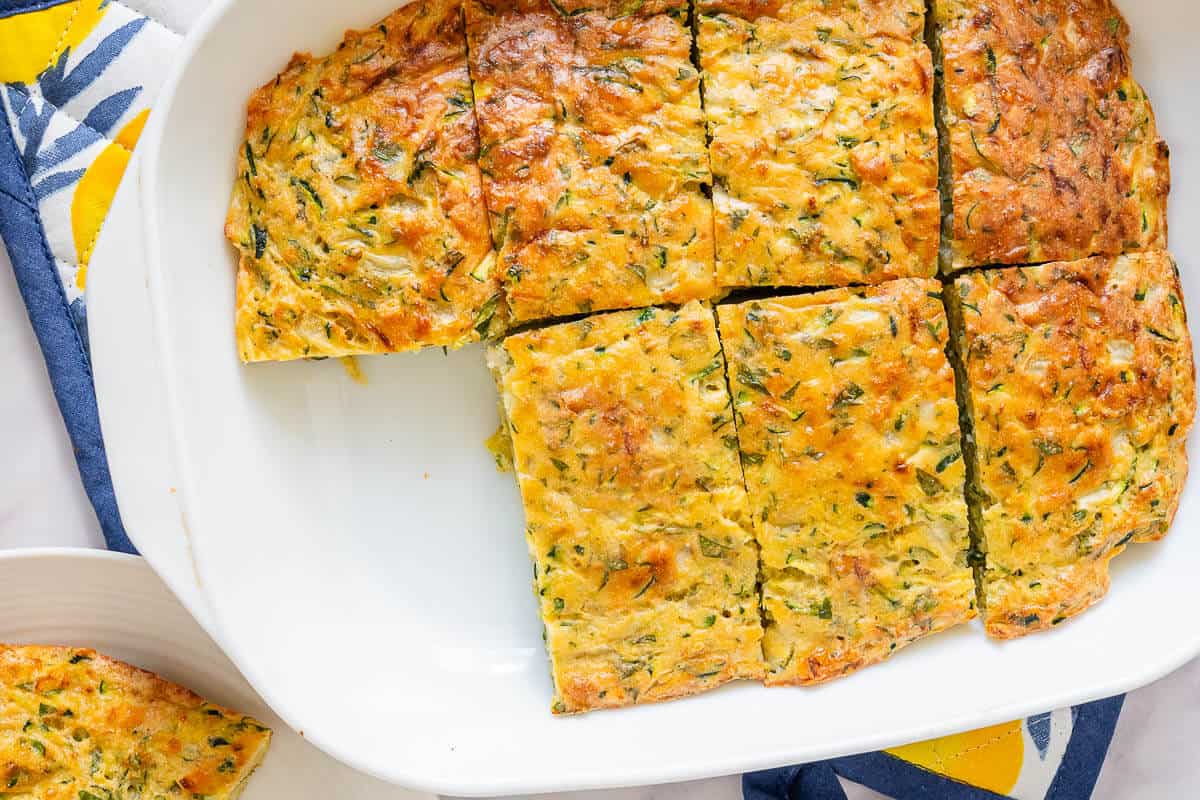 Tray of zucchini slice with a piece missing