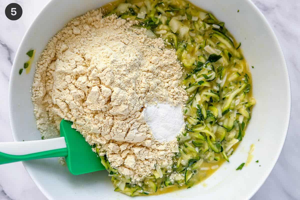 Grated zucchini, flour and baking powder added to batter bowl