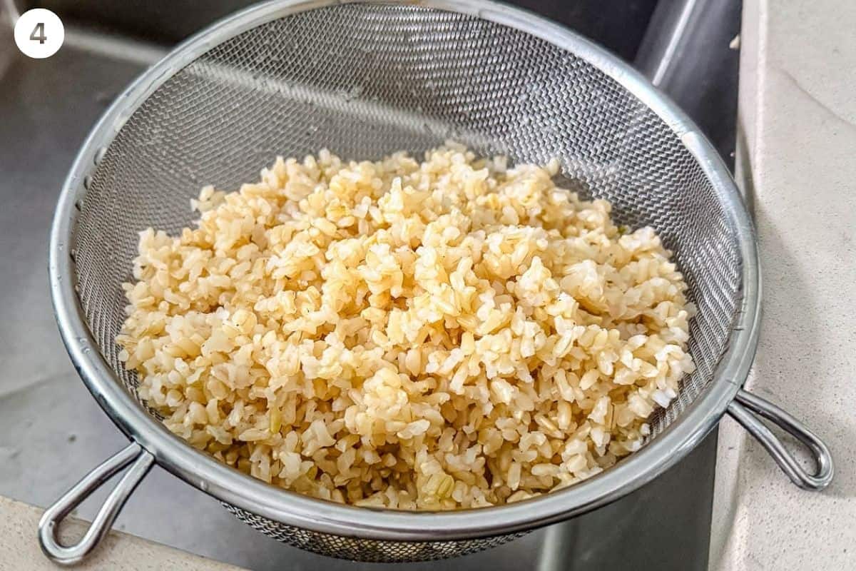 Cooked brown rice drained in a colander