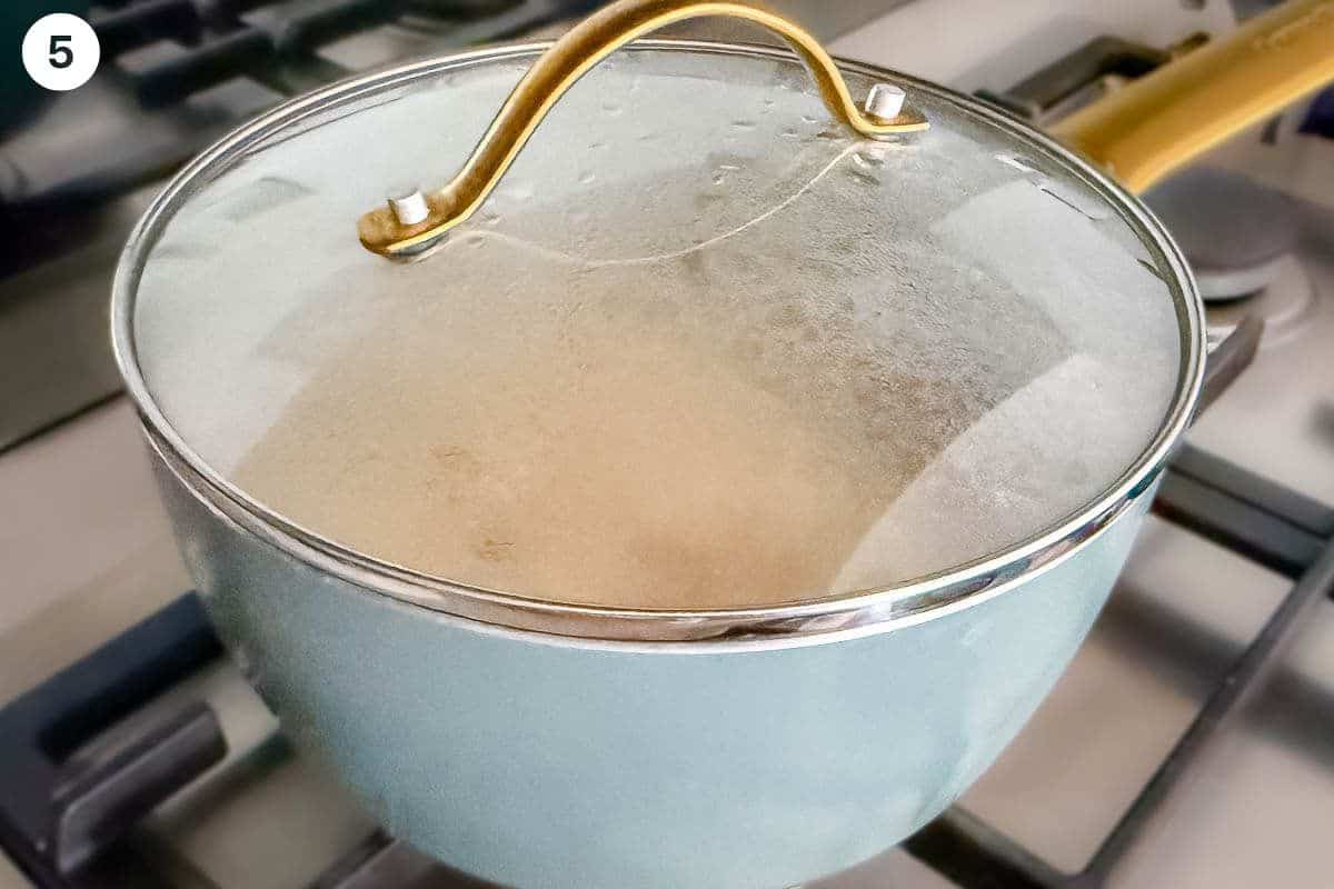 Cooked rice added back to the pot to steam for the final minutes