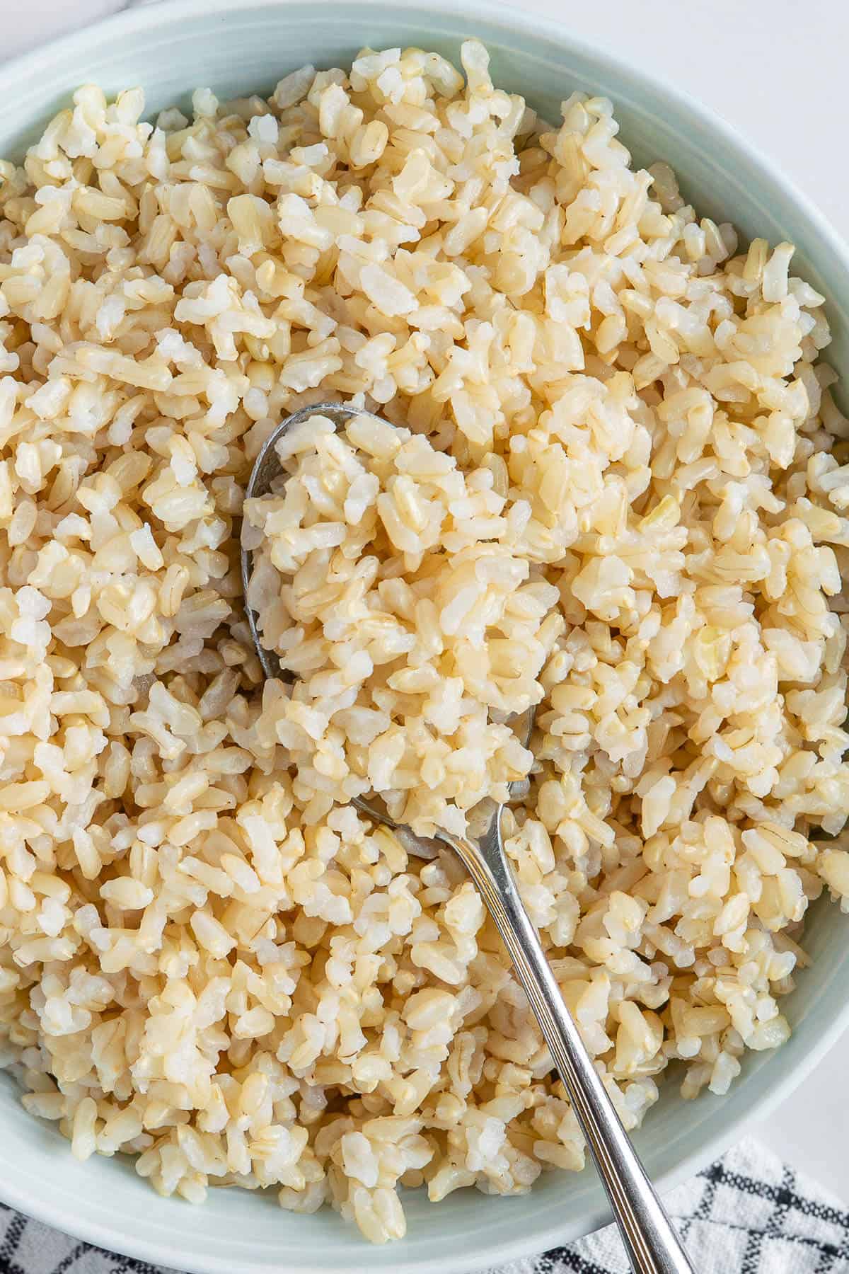 How to cook brown rice, served in a bowl with a spoon