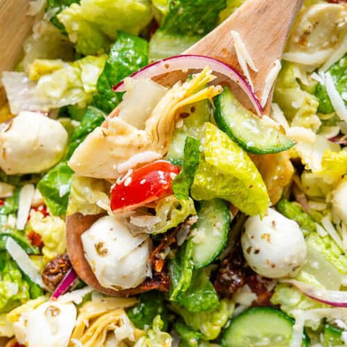 Italian Chopped Salad with spoon coming out of a bowl