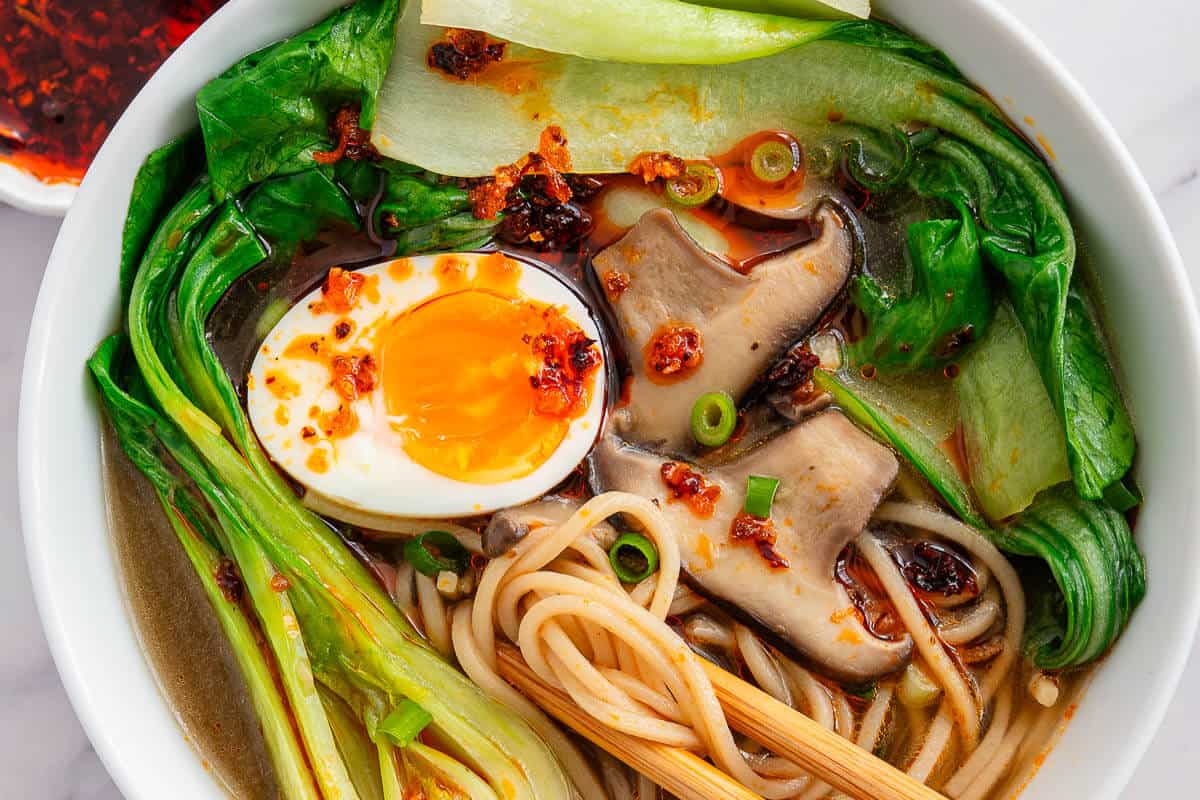 Close up of bokchoy soup bowl with chopsticks