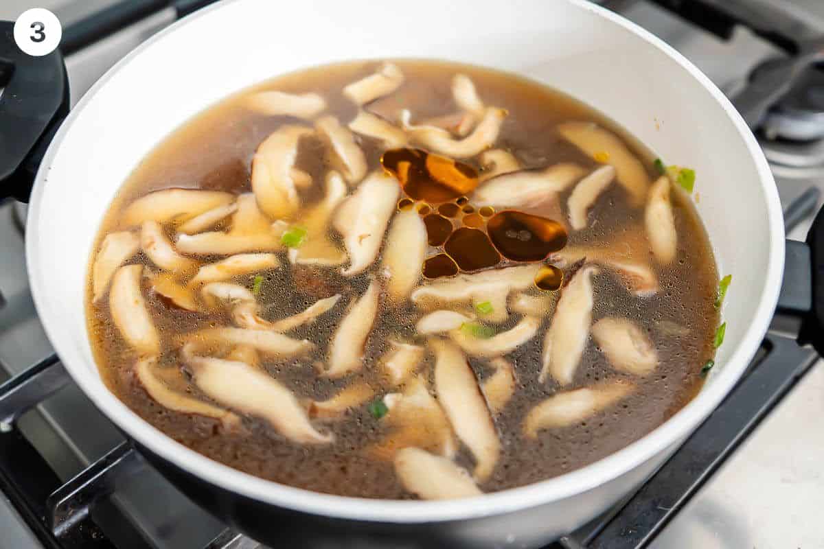 Vegetable broth, soy sauce, sesame oil added to the pot