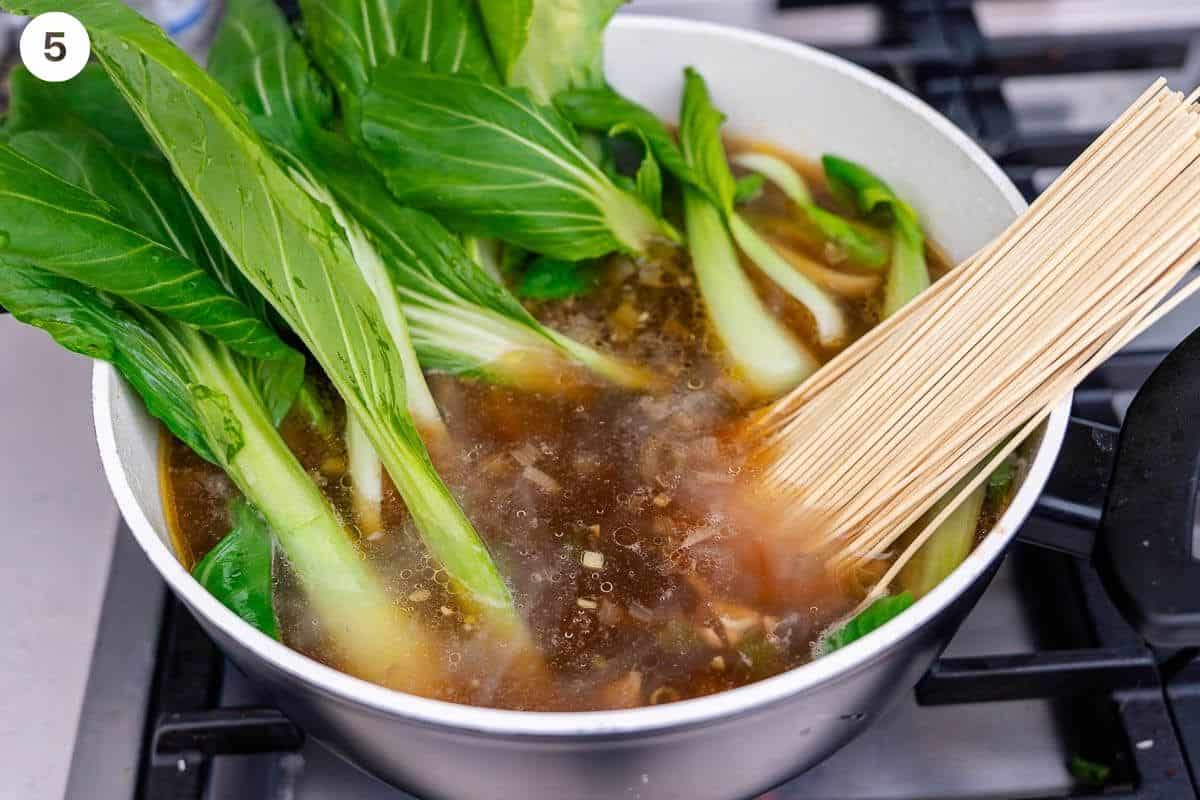 Boychoy and noodles added to the soup pot