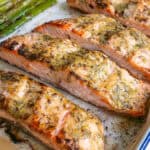 Baked dijon salmon fillets on an oven tray