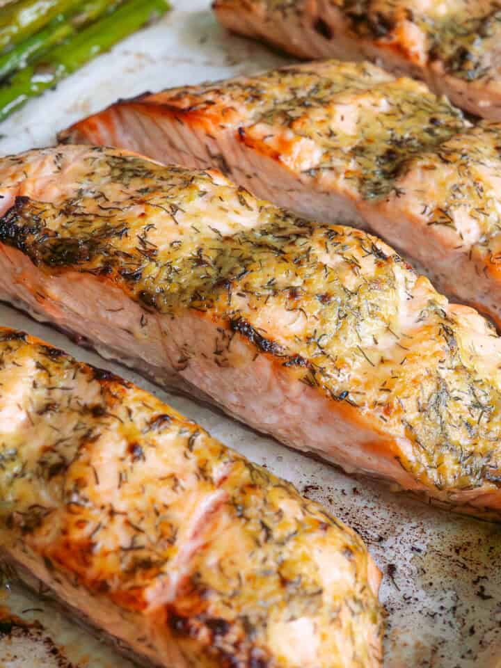 Baked dijon salmon fillets on an oven tray