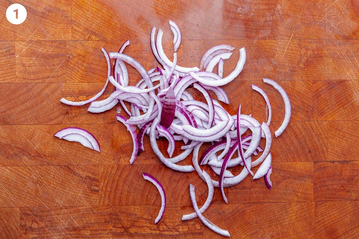 Red onion sliced on a cutting board