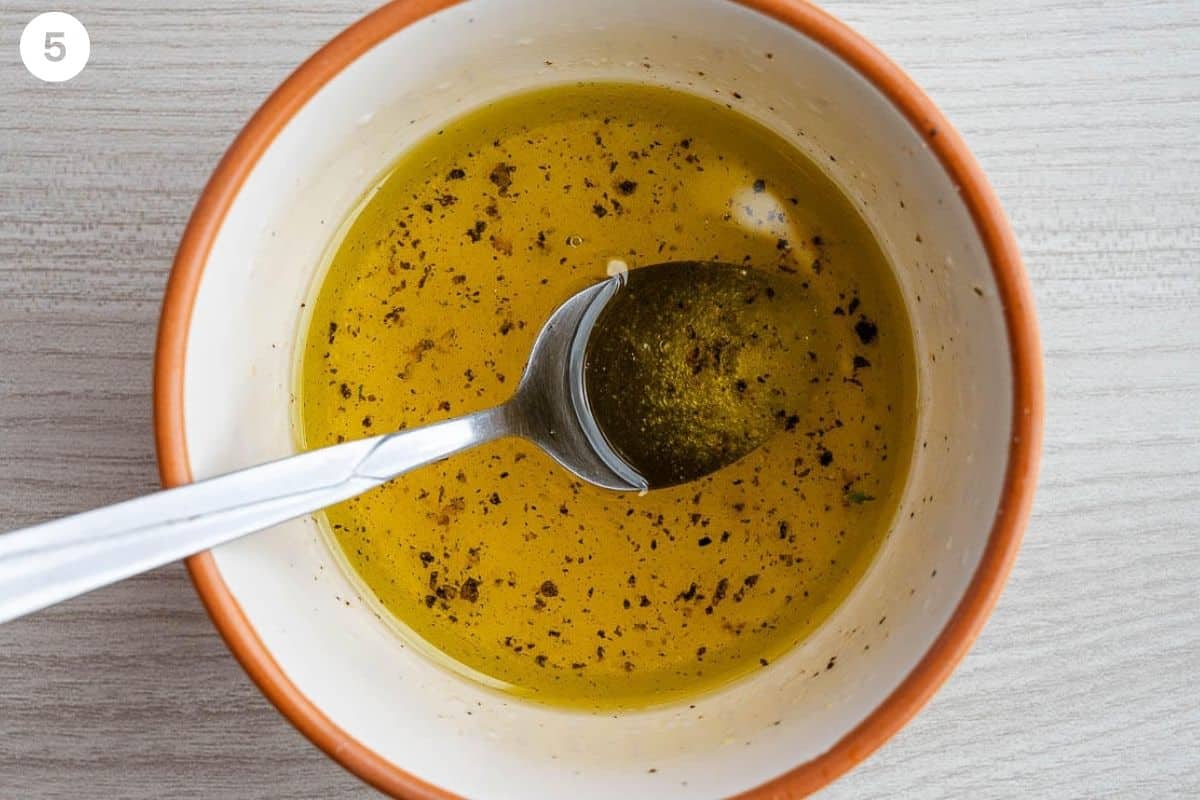 Dressing ingredients added and mixed in a small bowl