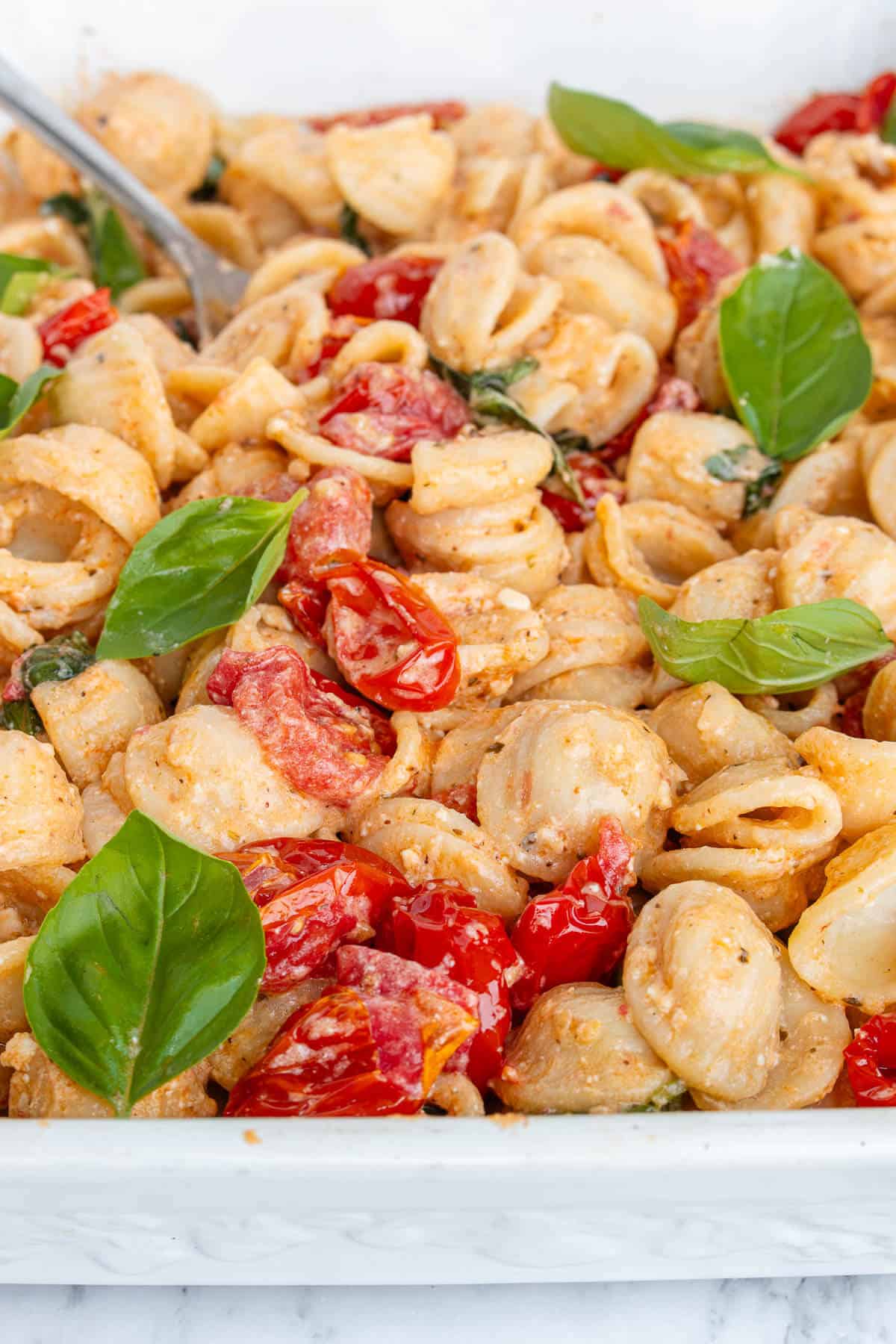 Baked feta pasta with cherry tomatoes, garlic and fresh basil