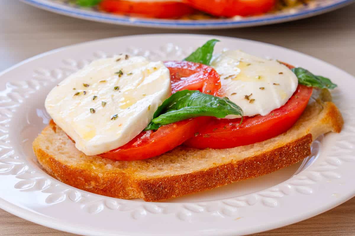 Caprese salad topped on toasted bread