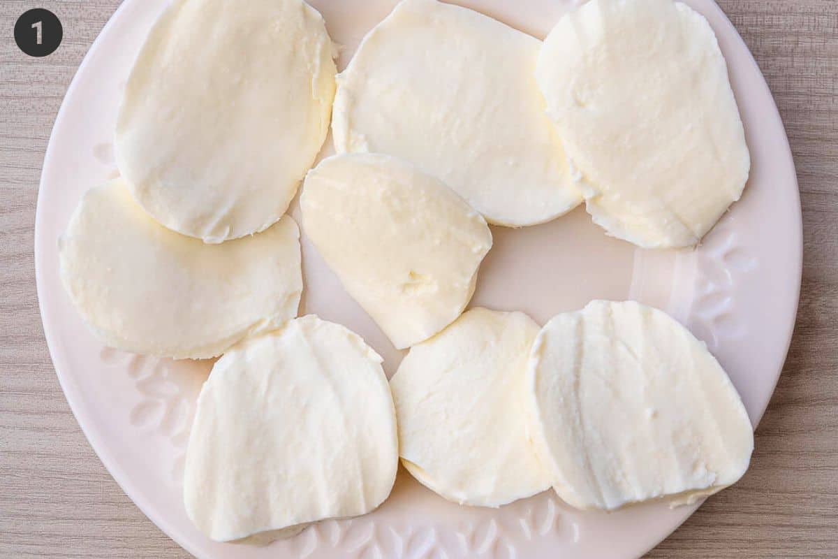 Fresh mozzarella sliced and placed on paper towels