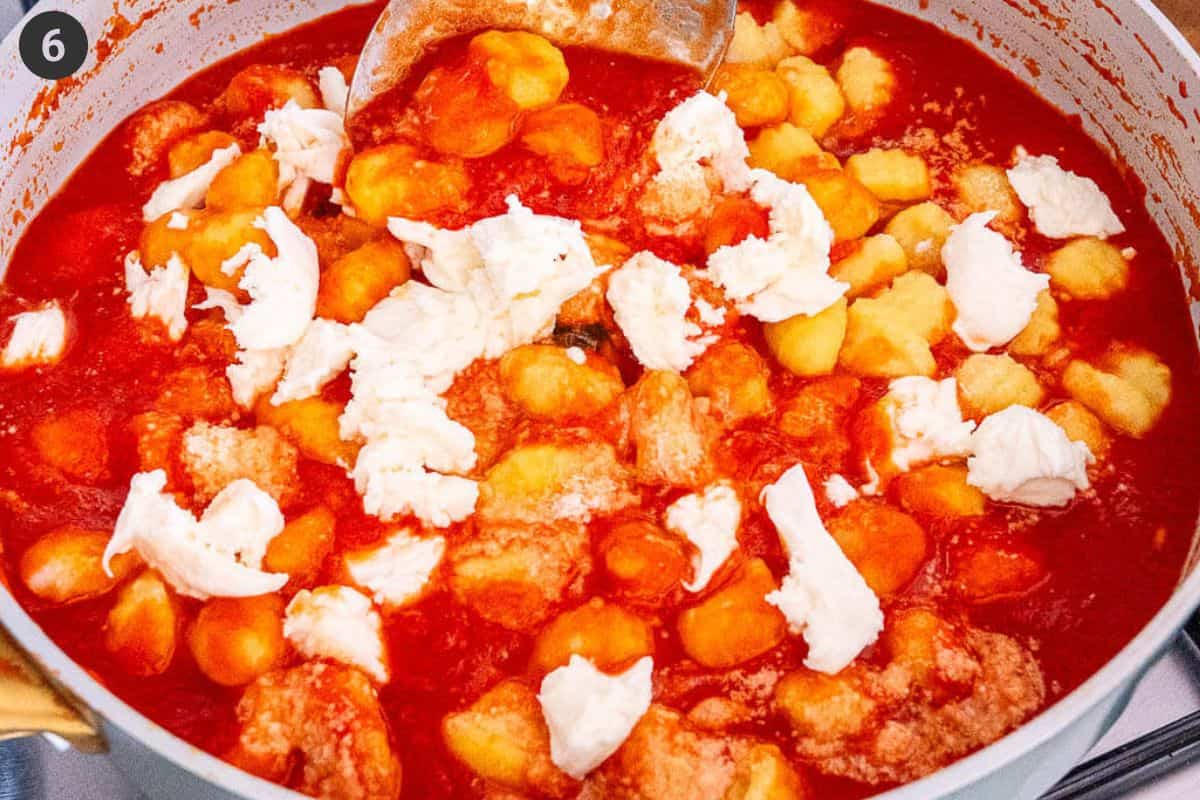 Mozzarella and parmesan cheese added to the sauce pan