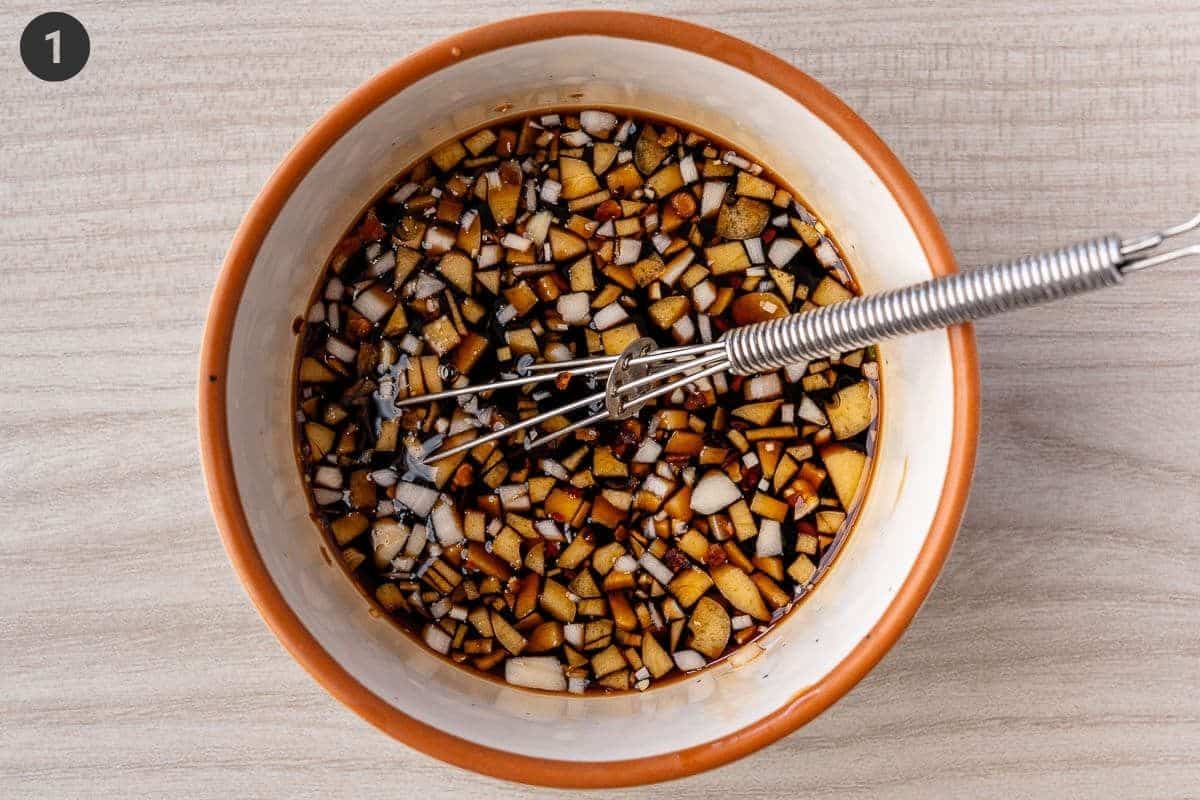 Honey garlic sauce ingredients added to a small bowl and mixed
